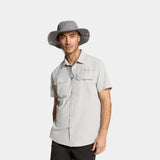 Man wearing a gray wide-brimmed hat and light gray shirt on a white background