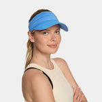 Missions Cooling Vibrant Blue visor on a white background on a woman