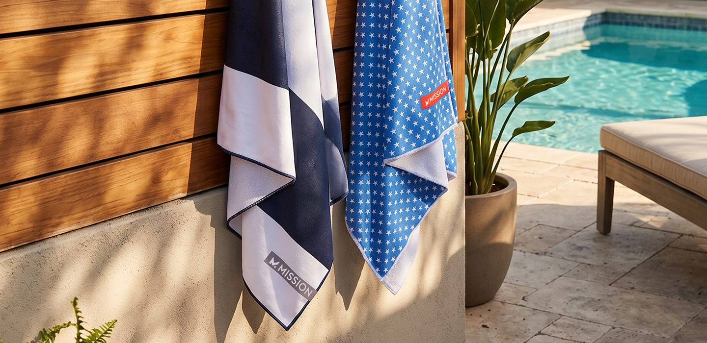 New Beach Towels by Mission hanging in front of pool