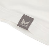 Close-up of a gray tag with 'Mission' logo on a white background