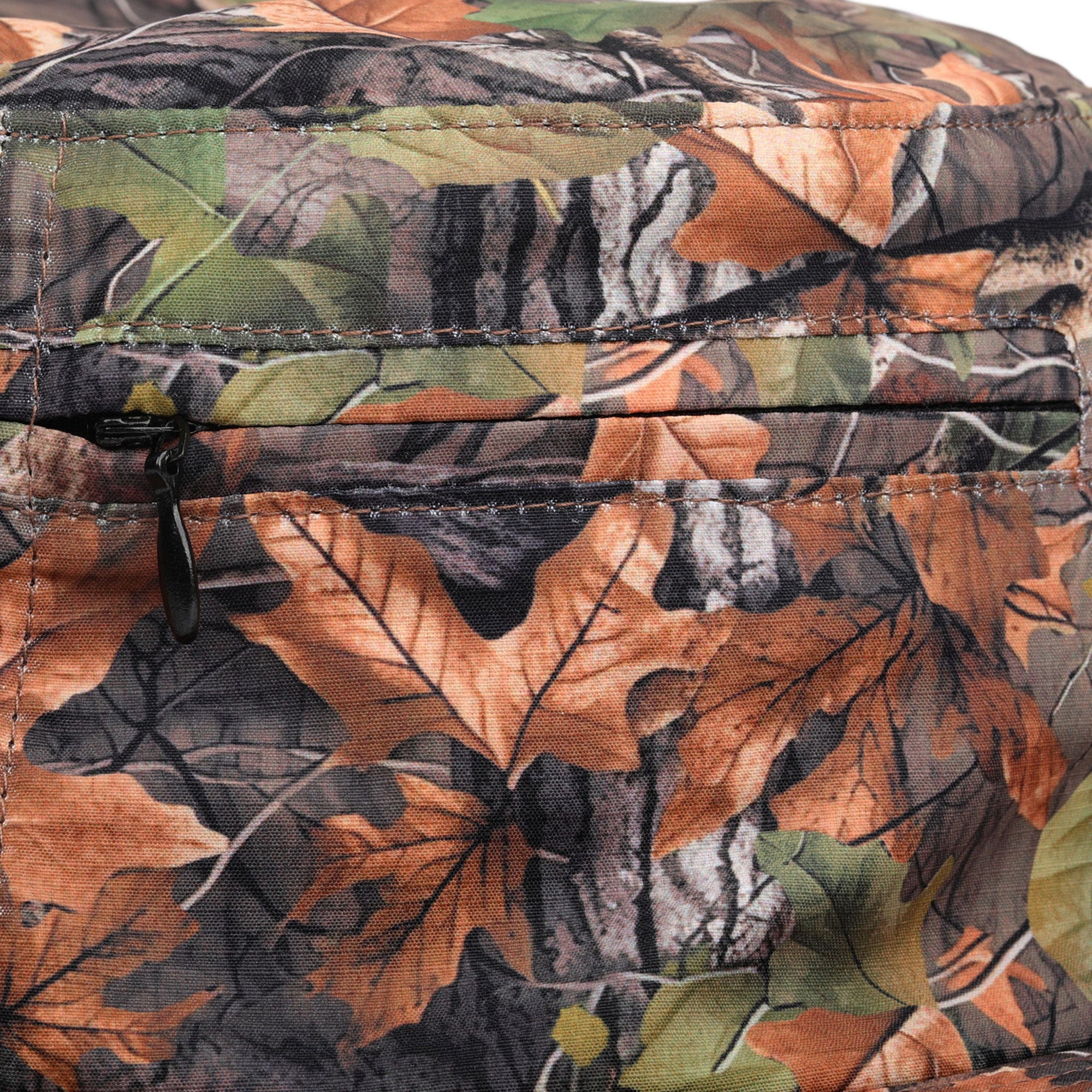 Close-up of a camouflage-patterned bag with leaf design