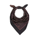 Black and brown patterned scarf on a white background