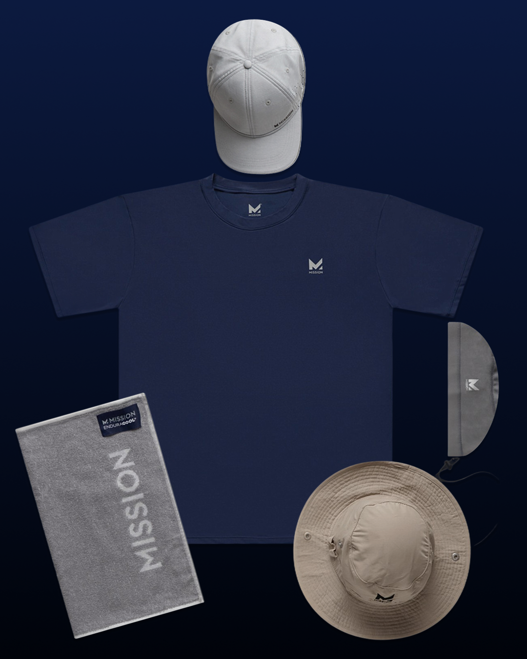 A coordinated apparel and accessory flat lay on a dark blue background, including a navy short-sleeve T-shirt with a small white chest logo, a white baseball cap, a light gray towel with large vertical MISSION text, a gray visor, and a beige wide-brim sun hat.