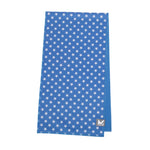 A blue fabric item, likely a towel or blanket, featuring a white star pattern and a small gray square logo with a white 'M' in the bottom right corner, shown against a plain white background.