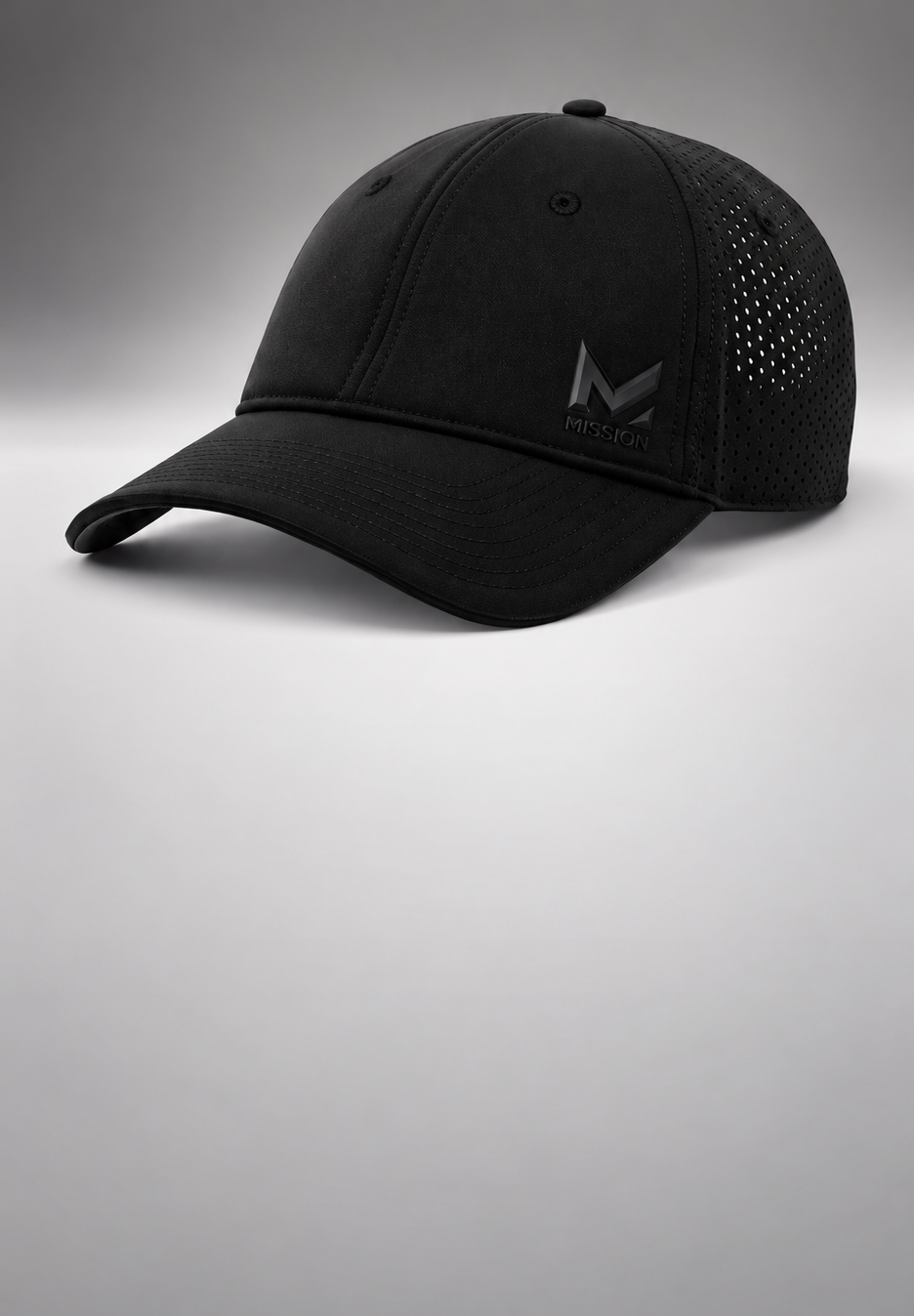 A black baseball cap with a structured front panel, curved brim, and perforated mesh back panels, featuring a tonal black embroidered logo on the front, set against a gray gradient background.