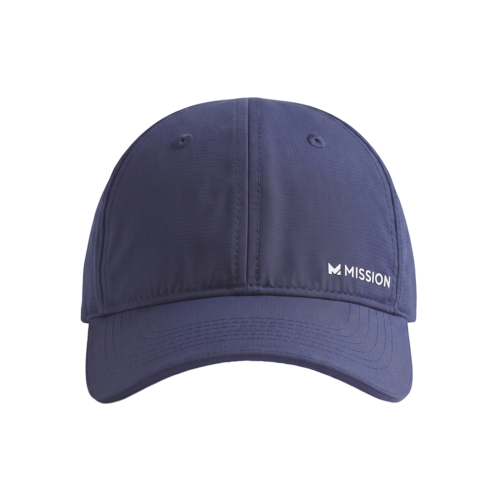 A navy blue baseball cap with a curved brim, featuring a white embroidered 'MISSION' logo on the front right panel, shown against a solid white background.