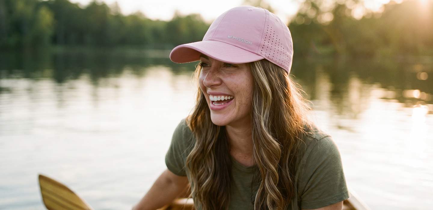 Woman wearing a pink Mission Performance Cooling Hat